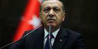 <p>Tayyip Erdogan acusou os jornalistas estrangeiros de agirem como espiões. Na foto, o primeiro-ministro da Turquia discursa durante uma reunião no Parlamento em Ancara, em 3 de junho</p>  Foto: Reuters