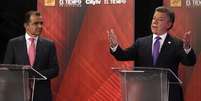 <p>Candidatos Juan Manuel Santos e Oscar Iván Zuluaga participam de debate na TV, em 9 de junho</p>  Foto: Reuters