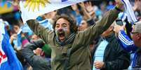 <p>Torcedores do Uruguai fizeram a festa na Arena Corinthians com a vitória por 2 a 1 contra a Inglaterra</p>  Foto: Getty Images 