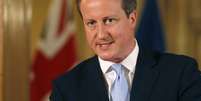 <p>Primeiro-ministro da Grã-Bretanha, David Cameron fala durante uma coletiva de imprensa conjunta com o secretário-geral da Otan, Anders Fogh Rasmussen, em Downing Street, centro de Londres, em 19 de junho</p>  Foto: Reuters