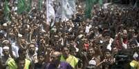 <p><span style="color: rgb(51, 51, 44); font-family: OpenSans, sans-serif; font-size: 14px; font-weight: 600; line-height: 19.600000381469727px; text-align: right;">Apoiadores do Hamas participam de uma manifestação contra o seqüestro e morte de um adolescente palestino por israelenses em Jerusalém, na sexta-feira (4); manifestação ocorre durante o funeral do adolescente palestino Mohammed Abu Khder</span></p>  Foto: AFP