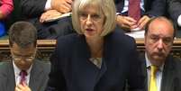 <p>Secretária do Interior, Theresa May, anuncia aos deputados na Câmara dos Comuns, em Londres, a revisão nas investigações sobre abuso sexual</p>  Foto: PA / AP