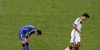 Messi vomita em campo durante a final da Copa do Mundo contra a Alemanha no Maracanã  Foto: Themba Hadebe / Reuters