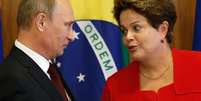 <p>Vladimir Putin, da Rússia, e Dilma Rousseff</p>  Foto: Eraldo Peres / AP