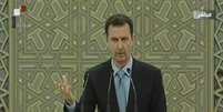 O presidente Bashar al-Assad discursa durante cerimônia de posse para novo mandato em meio à guerra na Síria; a cerimônia foi transmitida pela televisão estatal do país  Foto: Televisão Síria / AFP