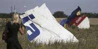 <p>Destroços do avião da Malaysia Airlines que caiu perto de Grabovo, na região de Donetsk, no leste da Ucrânia</p>  Foto: Sergei Karpukhin / Reuters