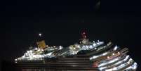 <p>Costa Concordia naufragou em janeiro de 2012, na ilha de Giglio, após se chocar contra rochas e encalhar</p>  Foto: Giuseppe Modesti / AP