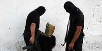 Seis palestinos foram executados pelo Hamas nesta sexta-feira por, supostamente, ajudar Israel  Foto: Stringer / Reuters