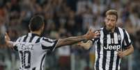 <p>Tevez e Marchisio fizeram os gols da Juventus</p>  Foto: Marco Bertorello / AFP