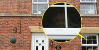O suposto fantasma apareceu em foto na janela da nova cada de Michelle  Foto: Daily Mail / Reprodução