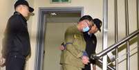 <p>Lee Joon-seok, capitão da balsa sul-coreana Sewol, chega ao Tribunal do Distrito de Gwangju, na Coreia do Sul, em 27 de outubro</p>  Foto: Yonhap/ Park Chul-hong / AP