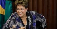 Presidente Dilma Rousseff sorri durante reunião com líderes de partidos da base aliada no Congresso, em Brasília. 1/12/2014.  Foto: Ueslei Marcelino / Reuters