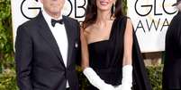 <p>George Clooney e Amal Alamuddin no tapete vermelho do Globo de Ouro</p>  Foto: Frazer Harrison / Getty Images 