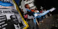 <p>Imagem do procurador argentino Alberto Nisman durante manifesta&ccedil;&atilde;o em Buenos Aires ap&oacute;s sua morte</p>  Foto: Marcos Brindicci / Reuters