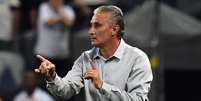 <p>Tite preferiu elogiar a atuação coletiva do Corinthians</p>  Foto: Nelson Almeida / AFP