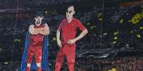Ribéry e Robben ganharam caricaturas do Batman e do Robin, respectivamente  Foto: Gunter Schiffmann / AFP