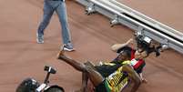 Tetracampeão Usain Bolt foi atropelado por cinegrafista enquanto comemorava  Foto: Rolex Dela Pena / EFE