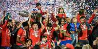 Jogadores do Chile comemoram o título da Copa América depois da vitória sobre a Argentina  Foto: Nelson Almeida / AFP