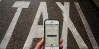 Serviço de caronas pagas do Uber é alvo de projetos de leis em diversas cidades do país  Foto: Getty