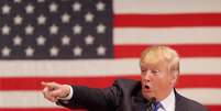 Donald Trump discursa para veteranos de guerra em evento paralelo ao debate de pré-candidatos do partido Republicano  Foto: Getty Images