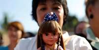 Tailandeses acreditam que bonecas trazem sorte e saúde   Foto: EFE