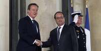 Primeiro-ministro inglês David Cameron e o presidente francês François Hollande  Foto: Getty Images