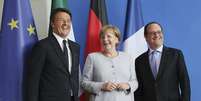 O primeiro-ministro italiano Matteo Renzi, a chanceler alemã Angela Merkel e o presidente francês François Hollande  Foto: EFE