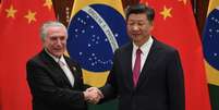 Em primeiro encontro bilateral, presidente brasileiro diz querer intensificar "sólida relação que foi construída ao longo do tempo" com a China  Foto: Getty Images