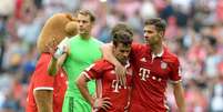 Manuel Neuer, Juan Bernat e Xabi Alonso não saíram nada satisfeitos com o resultado do jogo  Foto: EFE