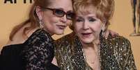 Debbie Reynolds junto de sua filha Carrie Fisher  Foto: Getty Images