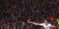 Cavani comemora gol que garantiria o PSG na próxima fase da Champions League. Em vão. (Foto: Josep Lago / AFP)  Foto: Lance!