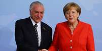 Michel Temer recebe as boas vindas da premiê Angela Merkel na Alemanha  Foto: Reuters