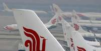 Aviões da Air China são vistos estacionados em aeroporto internacional de Pequim, China 
28/03/2016 REUTERS/Kim Kyung-Hoon/File Photo  Foto: Reuters