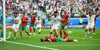 Aziz Bouhaddouz, do Marrocos, lamenta gol contra na partida contra o Irã 15/06/2018 REUTERS/Dylan Martinez  Foto: Reuters
