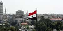 Bandeira da S&iacute;ria &eacute; vista em Damasco 20/04/2018 REUTERS/Ali Hashisho   Foto: Reuters