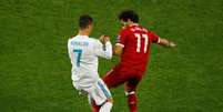 Cristiano Ronaldo e Salah disputam bola durante final da Liga dos Campeões entre Real Madrid e Liverpool 26/05/2018 REUTERS/Phil Noble  Foto: Reuters