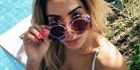 'Fiz uma lipo poderosa', brinca Anitta após comentário de fã sobre sua barriga seca  Foto: Divulgação, Instagram / Anitta / PurePeople