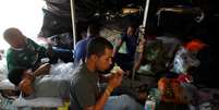 Imigrantes venezuelanos perto de estação de ônibus em Quito
 24/8/2018    REUTERS/Daniel Tapia   Foto: Reuters