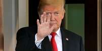 Trump acena na Casa Branca 
 28/9/2018     REUTERS/Joshua Roberts  Foto: Reuters