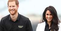 Meghan e Príncipe Harry usaram a mesma camisa social, do Invictus Game, no evento  Foto: Getty Images / PurePeople