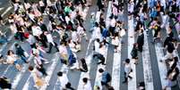 A crowd rushing past  Foto: Getty Images / BBC News Brasil