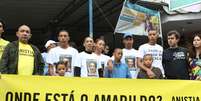 Manifestação organizada pela Anistia Internacional na comunidade da Rocinha em São Conrado, zona sul do Rio  Foto: Marcos Arcoverde / Estadão