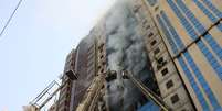 Bombeiros tentam apagar inc&ecirc;ndio em edif&iacute;cio comercial em Daca, Bangladesh
28/03/2019
REUTERS/Mohammad Ponir Hossain  Foto: Reuters