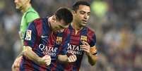 Messi e Xavi fizeram história juntos (Foto: Lluis Gene/AFP)  Foto: Lance!