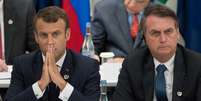 Emmanuel Macron e Jair Bolsonaro em reunião do G20  Foto: AFP / BBC News Brasil