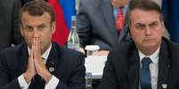 Macron disse que Bolsonaro mentiu ao dizer que atuaria contra o desmatamento, em encontro do G20 em junho, onde sentaram lado a lado  Foto: AFP / BBC News Brasil