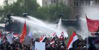 Pol&iacute;cia usa canh&otilde;es de &aacute;gua para dispersar protesto em Bagd&aacute;, capital do Iraque  Foto: EPA / Ansa - Brasil