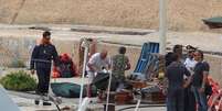 Caixões com corpos de mulheres mortas perto de Lampedusa, no Mediterrâneo  Foto: ANSA / Ansa - Brasil