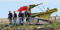 Destroços de avião da Malaysia Airlines no leste da Ucrânia, em julho de 2014  Foto: EPA / Ansa - Brasil