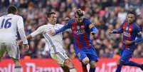 Messi e Cristiano Ronaldo em ação no 'El Clásico': dupla fez história no futebol espanhol (Foto: JOSEP LAGO / AFP)  Foto: Lance!